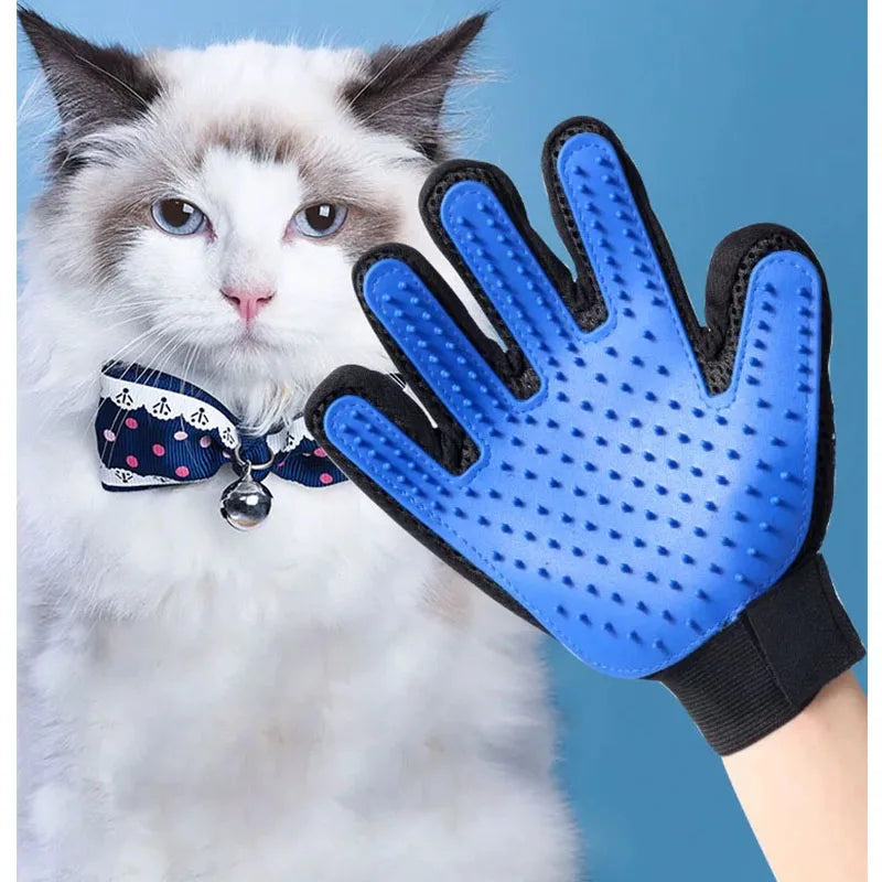 Blue silicone grooming glove with finger nubs and black cuff on a hand