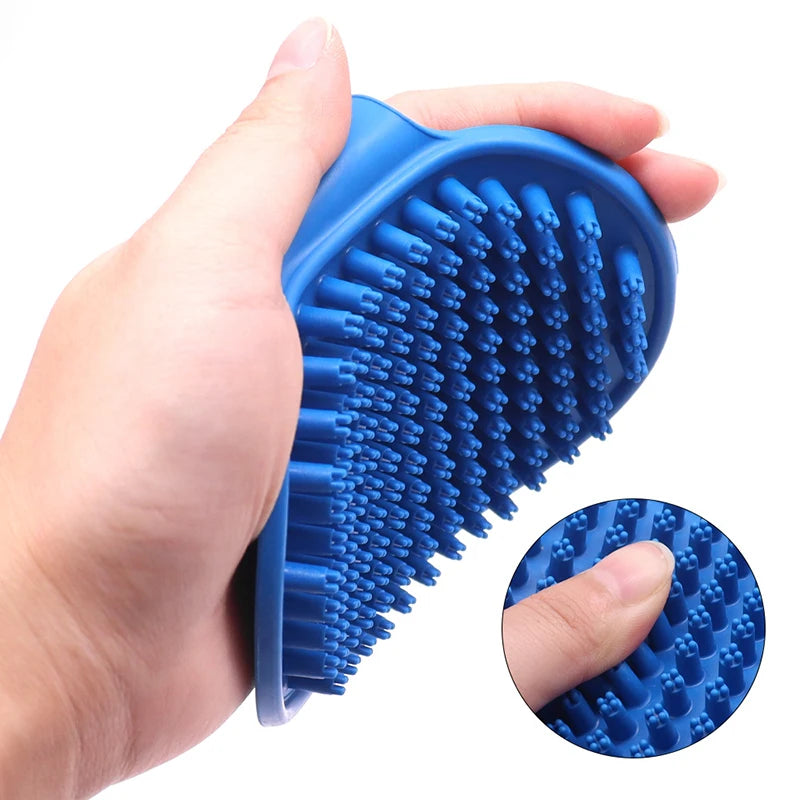 Blue rubber pet grooming brush with oval head and raised massage nubs