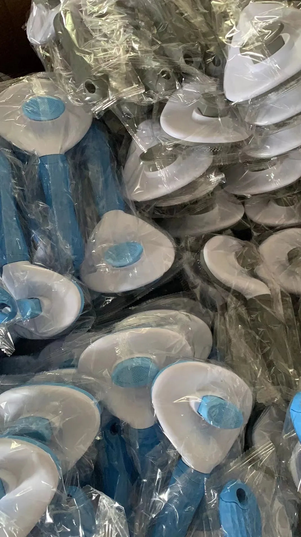 Assorted blue pet comb brushes with round pin heads, multiple units in packaging