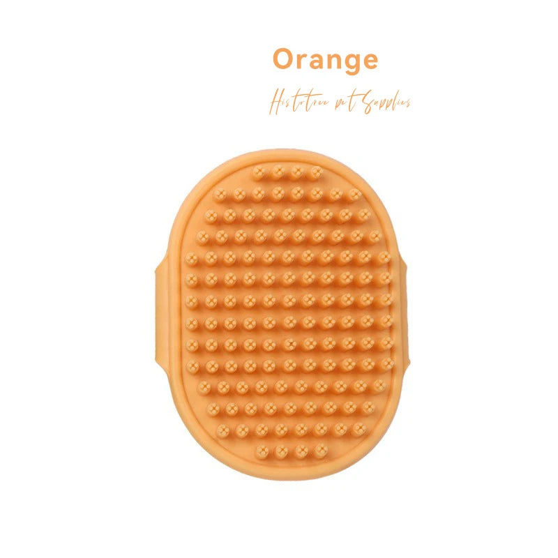 Orange rubber grooming comb for pets with raised massage nubs