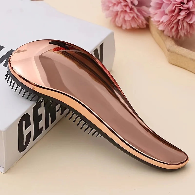 Pet grooming comb with rose-gold frame and black teeth