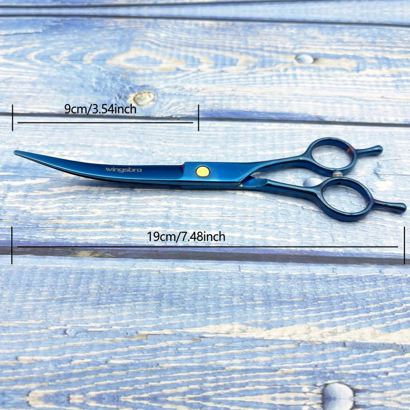 Blue grooming scissors with curved blades, silver finger rings and yellow accent.