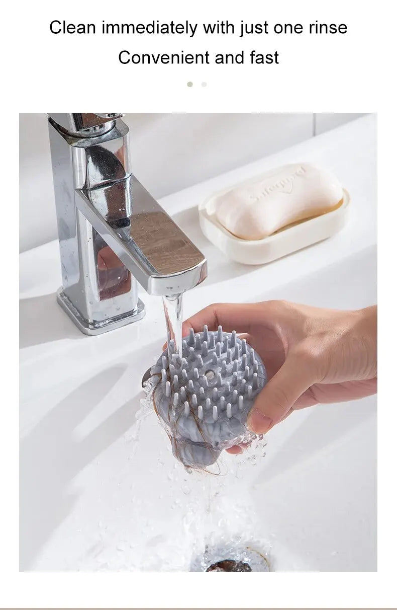 Grey silicone pet bath brush with bristles rinsed under running water