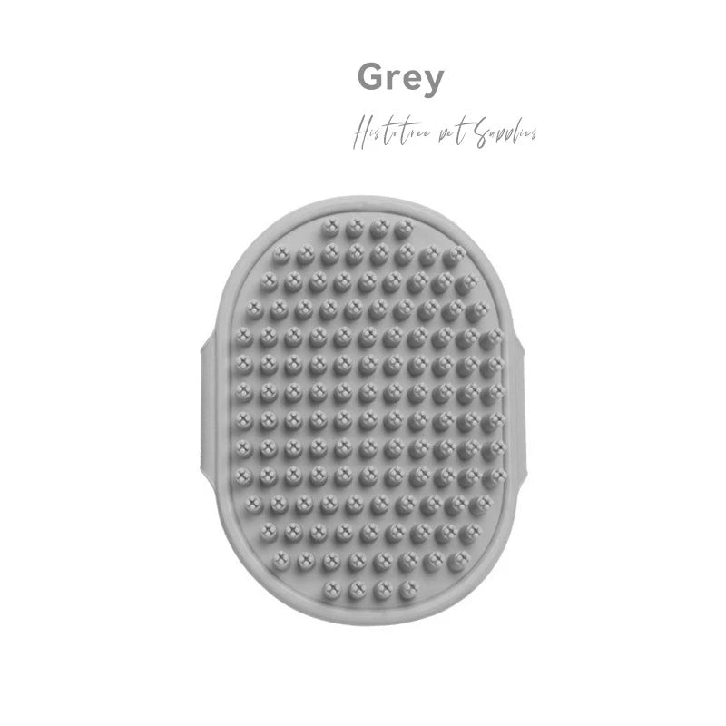 Gray rubber pet grooming brush with oval textured head and raised massage bumps