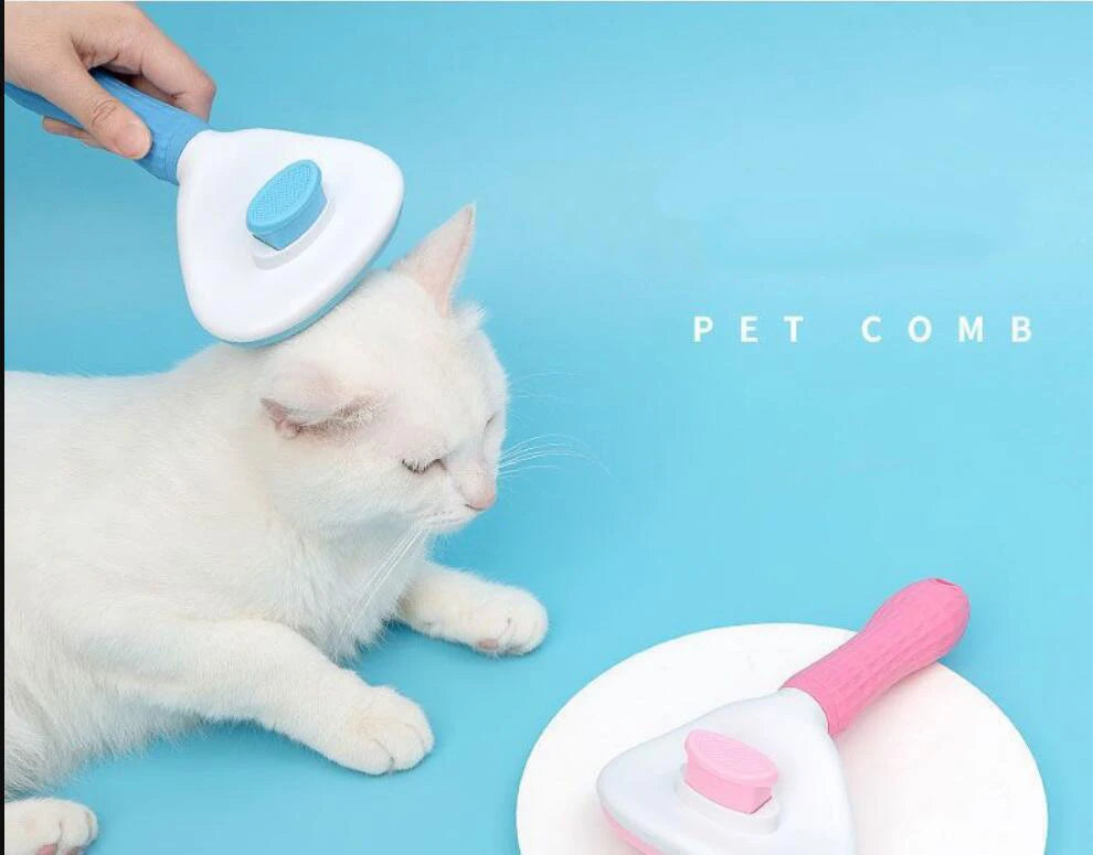 Pet grooming brush with blue handle and white base, brushing a white cat