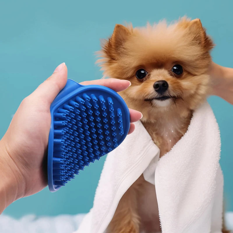 Blue rubber bath brush with oval head and raised nubs for dog grooming