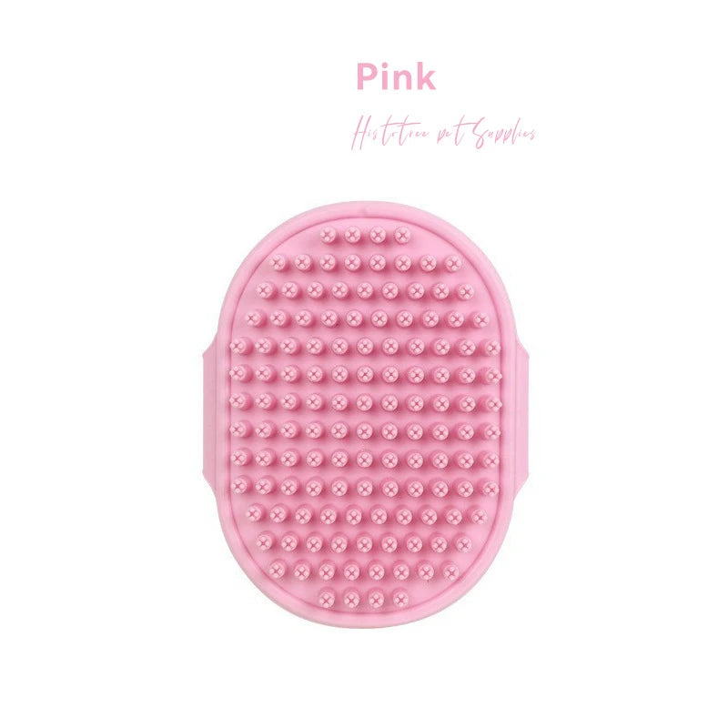 Pink rubber pet grooming brush with oval textured head and raised massage bumps
