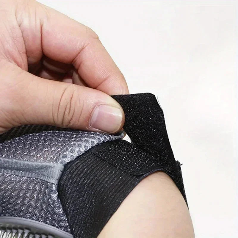 Light grey pet grooming glove with black wrist strap and raised TPR bristles